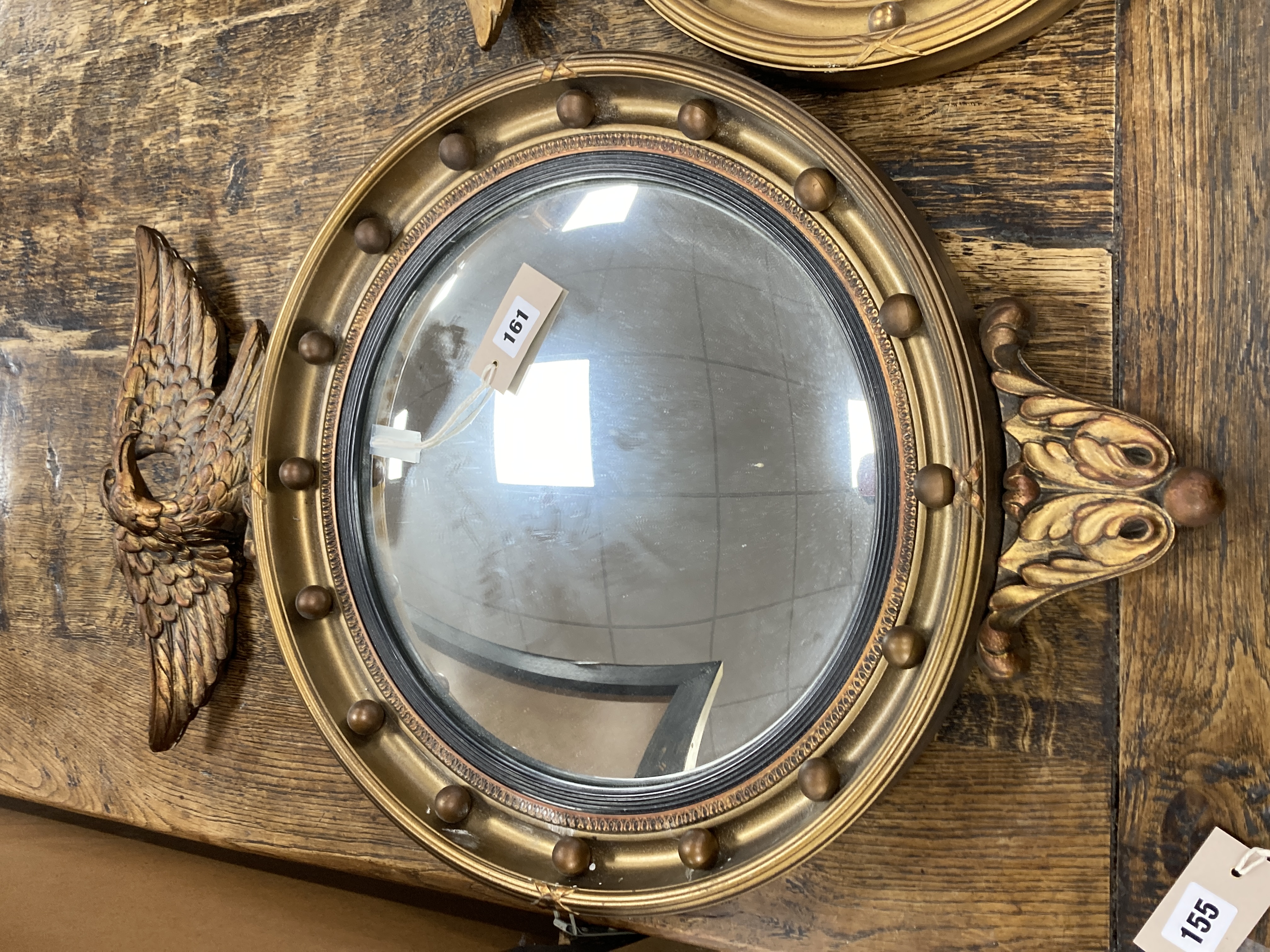 Two Regency style gilt-framed convex mirrors, larger 47cm diameter